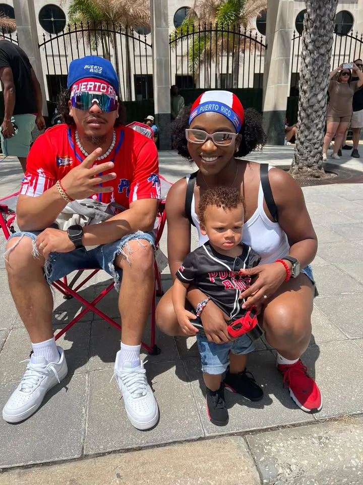 The couple behind Soulful Sazón with their daughter, wearing Puerto Rico colors.