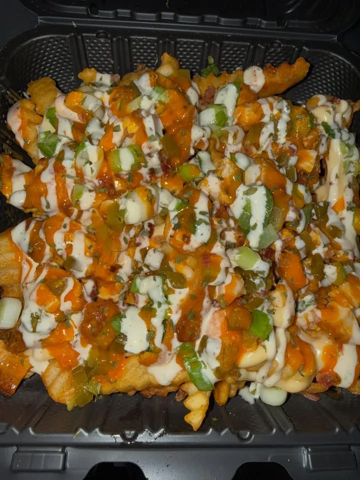 Fries loaded with chicken, sauces and toppings.
